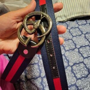 Navy and Red Belt with Snake Buckle He Has It has some minor peeling on the Insi